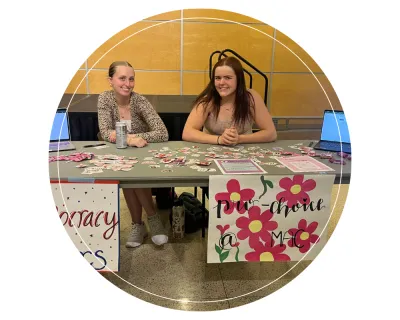 Emma tabling at an event