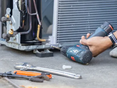 a main drilling to repair a broken Air Conditioner