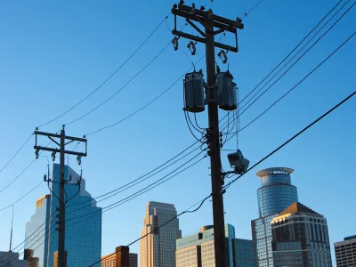 a powerline with the Minneapolis skyline in the background