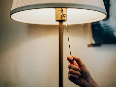 someone turning on a lamp