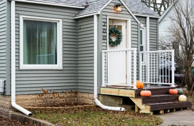 Tiny house with pumpkins on doorstep, Rochester, MN