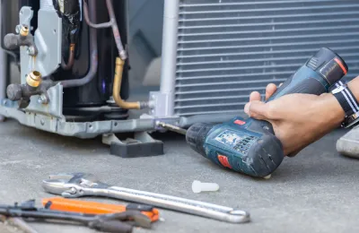 a main drilling to repair a broken Air Conditioner
