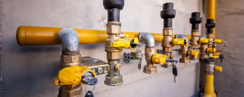 gas pipe and valve with keys on wall