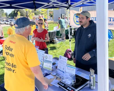 Kevin chats with a consumer at a CUB event