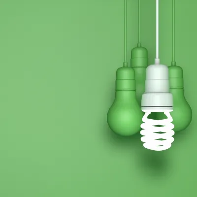 green wall, green fluorescent bulbs, with a single LED