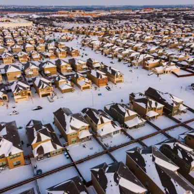 a residential development blanketed with snow