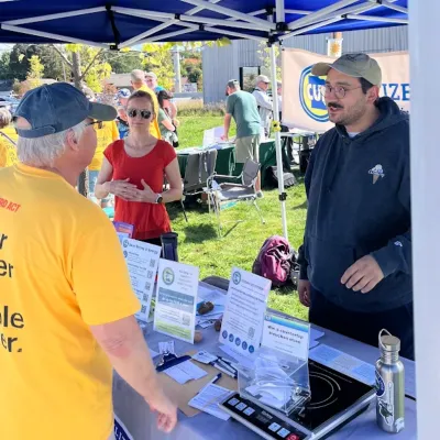 Kevin chats with a consumer at a CUB event