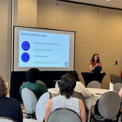 Executive Director Annie Levenson-Falk giving a presentation on affordability